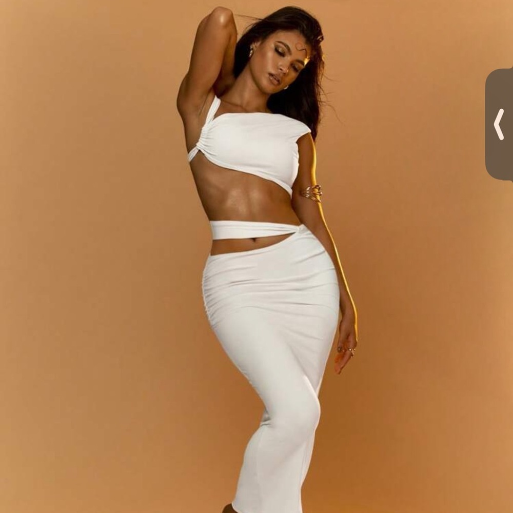 Asymmetrical crop top and cut out bodycon